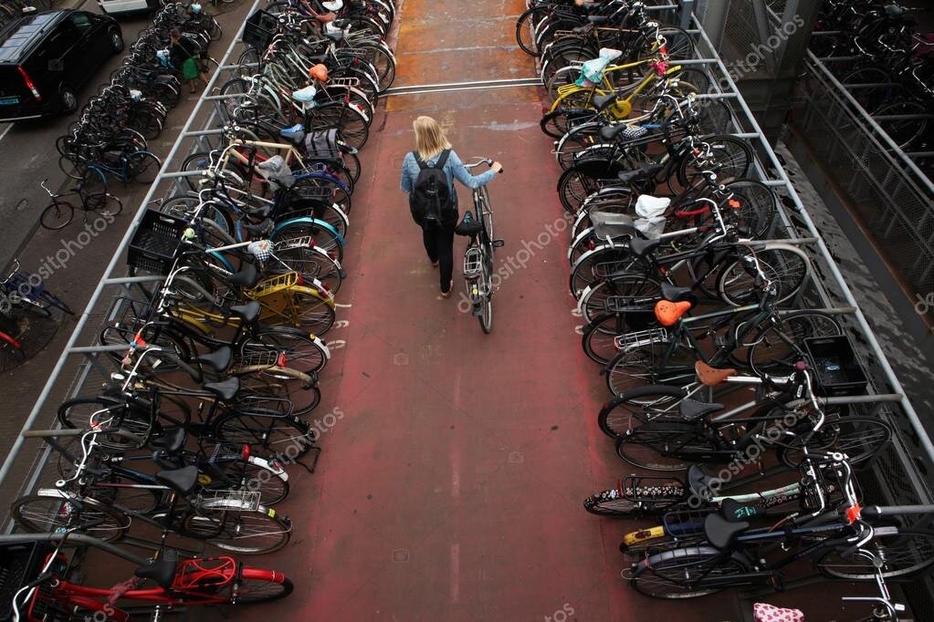 фото взято https://ru.depositphotos.com/70915923/stock-photo-bicycle-parking-station-in-amsterdam.html