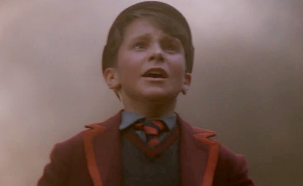 Кристиан Бэйл в роли Джима Грэхема. Кадр из кинофильма "Империя Солнца", 1987 г., режиссер Стивен Спилберг, сценаристы Том Стоппард, Менно Мейес, Дж. Г. Баллард, композитор Джон Уильямс. Скриншот кадра для иллюстрации