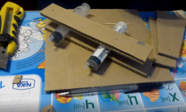 How to make a hydraulic crane out of cardboard experiment