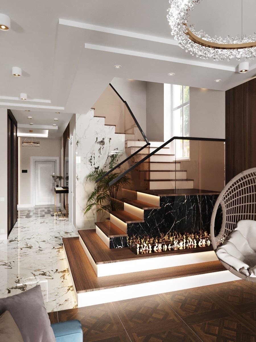 Зона гостиной с лестницей. Обратите внимание, как стеклянные ограждения облегчают всю лестничную конструкцию. И как здорово зонировано одно большое помещение, разными напольными покрытиями! Входная зона и кухня-мрамор. Зона дивана и ТВ - паркетная доска.