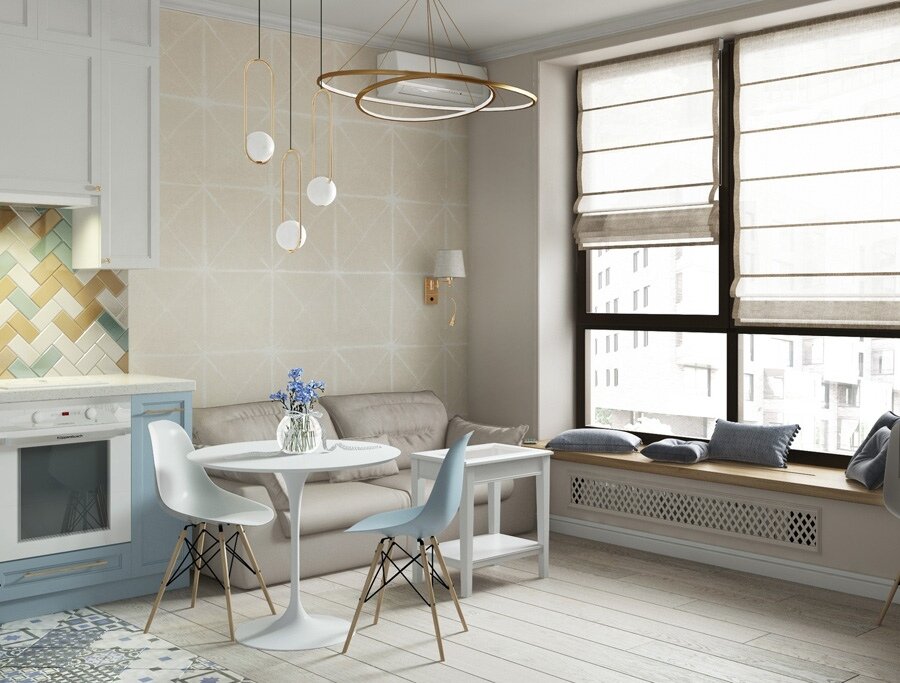 Огромное достоинство этой квартиры-студии небольшого метража — огромное окно, вдоль которой было решено разместить уютное место для чтения с подушками. 