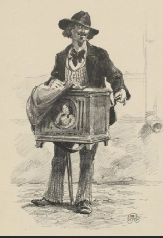 фото из интернета. Конечно, наш шарманщик не был похож на этого и шарманка была другой.