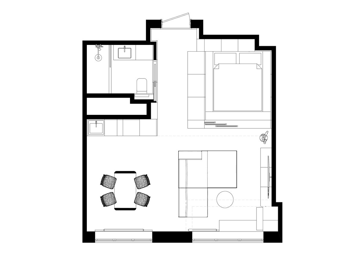 Студийную планировку решили сохранить, изолировали лишь санузел. Спальню отгородили при помощи ряда шкафов и раздвижной реечной перегородки. Лоджию присоединили к комнате, чтобы увеличить полезную площадь и впустить больше света.