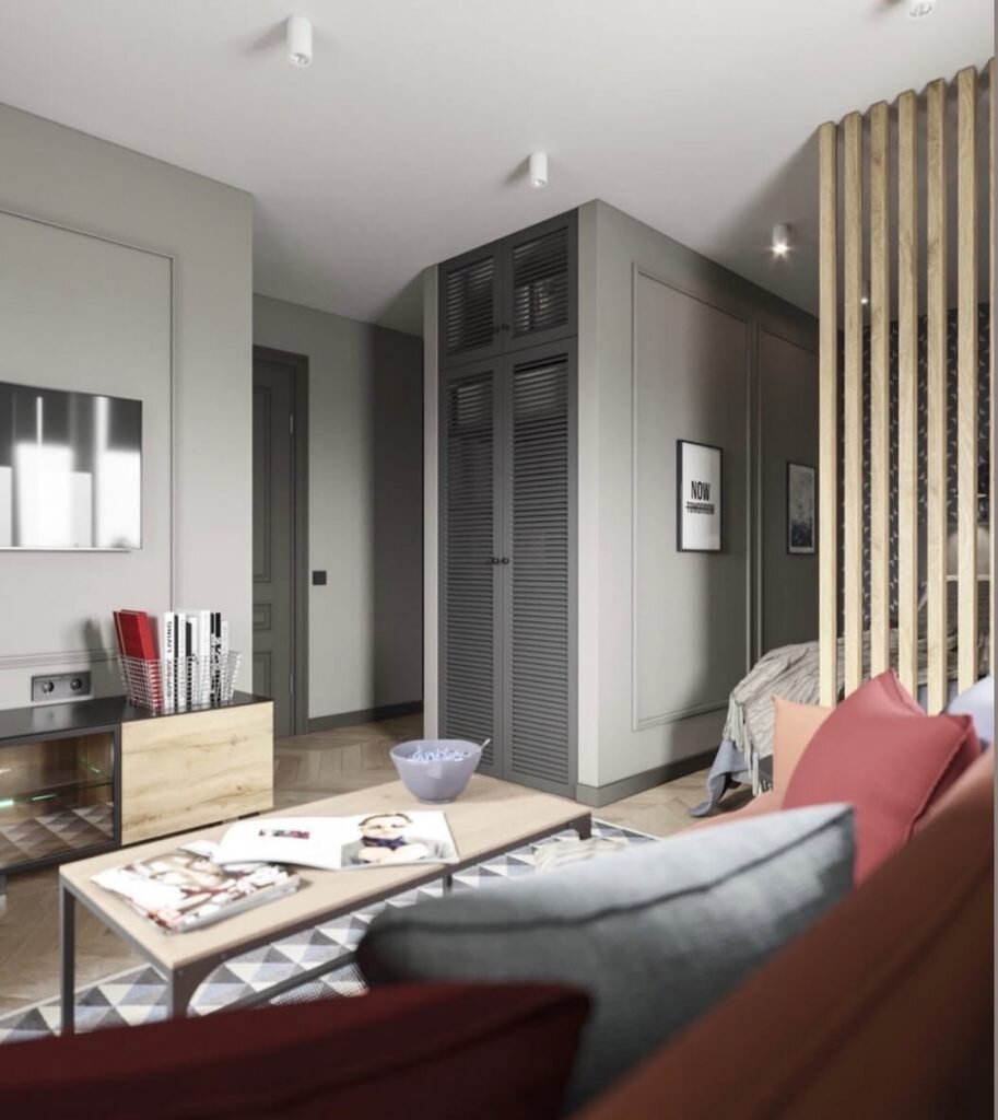 Если вы ищете интересные цветовые сочетания для серого базового оттенка стен, то рекомендуем вам обратить внимание на это решение для квартиры площадью 35 м² в эффектной палитре. Серый цвет часто используется в качестве базы для скандинавского стиля, он сложный и интересный, в отличии от белого делает помещение ярче и в отличии от бежевого подходит любителям холодных оттенков.