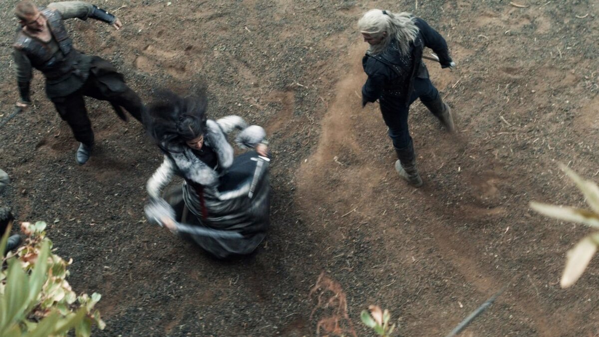 Геральт и Йеннифер сражаются с разбойниками возле пещеры дракона 