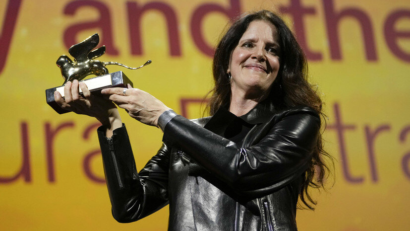     Director Laura Poitras holds the Golden Lion award for best film for 'All the Beauty and the Bloodshed' at the closing ceremony of the 79th edition of the Venice Film Festival in Venice, Italy, Saturday, Sept. 10, 2022. AP Domenico Stinellis