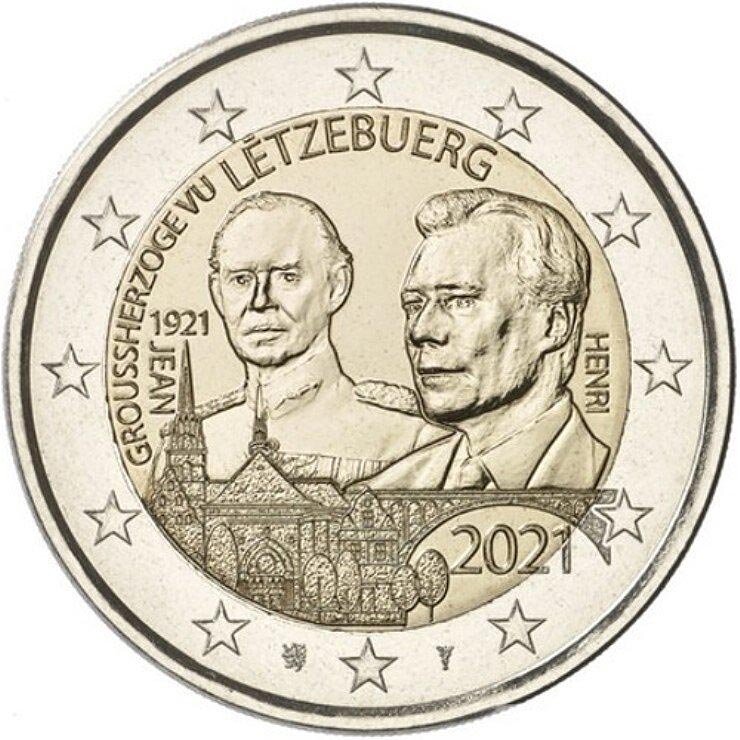 На реверсе монеты 2 евро, размещено: во внешнем круге - традиционные 12 звезд ЕС
во внутреннем круге изображена Великий герцог Люксембурга Жан тут же размещен портрет Его Королевского Высочества, великого князя Анри
справа и слева вертикально указаны имена "JEAN" и "HENRI"
тут же даты "1921"
ниже дата выпуска монеты "2021"
вверху указание страны-эмитента “LUXEMBOURG”