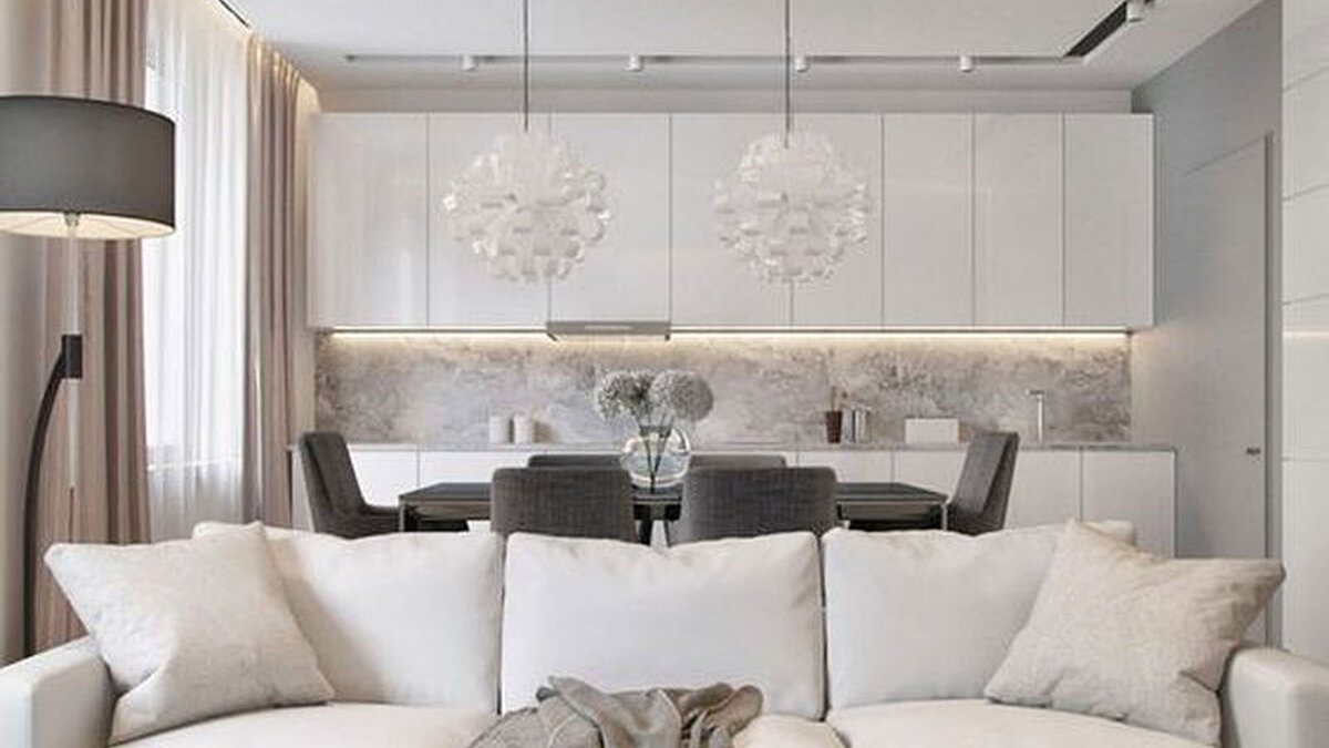 Современный дизайн кухонного гарнитура с островом в интерьере кухни гостиной.