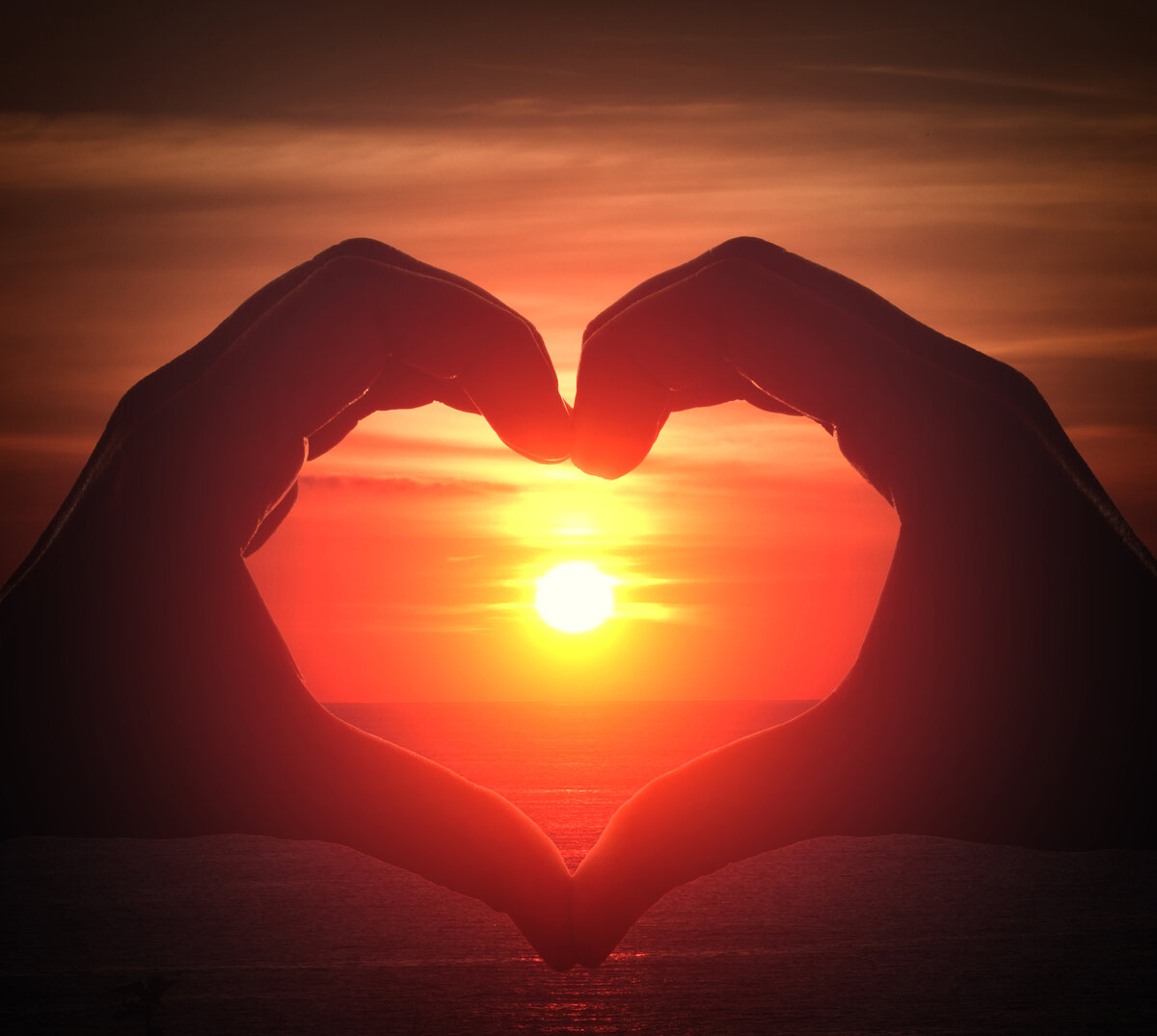 https://jooinn.com/images/hand-silhouette-in-heart-shape-with-sunset-in-the-middle.jpg