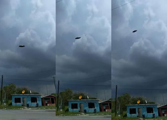
Таинственный объект, предположительно НЛО, завис перед темным облаком.