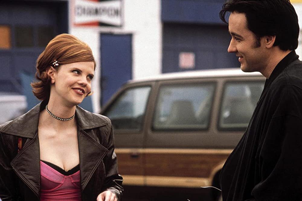 Кирстен Уоррен и Джон Кьюсак в фильме «Управляя полётами»