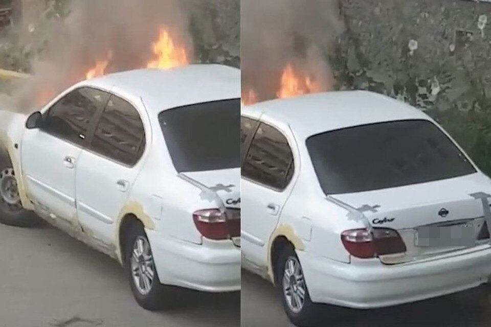     В Новосибирске иномарка загорелась во дворе жилого дома. Фото: Кадр из видео\"АСТ-54"