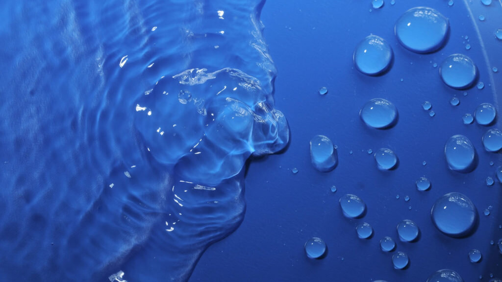    Some Water Drops on a Blue Textured Background Александр Шереметьев