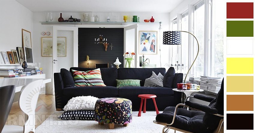 Черно-белый интерьер намекает на творческую натуру его хозяина. Смелое сочетание белых и черных стен дополнено массивным диваном темного тона с яркими текстильными деталями