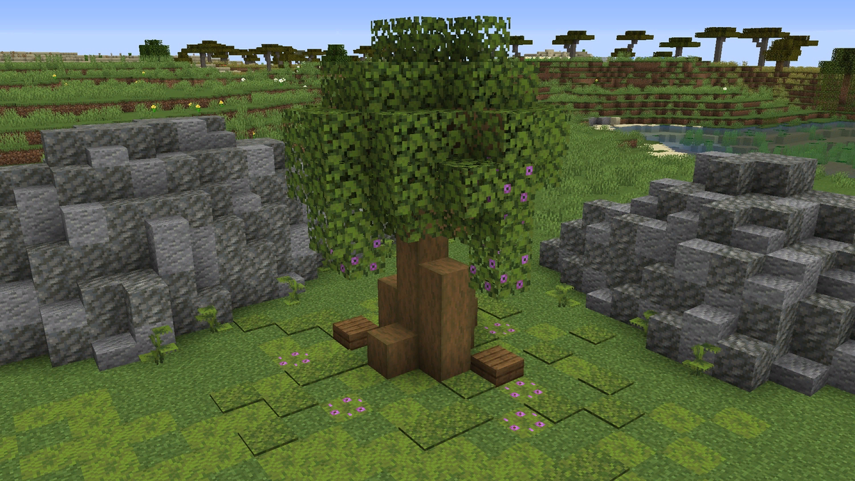 Вы можете поставить цветущие деревья азалии на уровень с землей, чтобы они выглядели как опавшие цветы вокруг большого дерева.