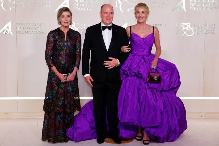 Princess of Hanover Caroline, Prince Albert II of Monaco and Sharon Stone pose on the red carpet ahead of the 2021 Monte-Carlo Gala for Planetary Health in Monaco September 23, 2021. REUTERS/Eric Gaillard