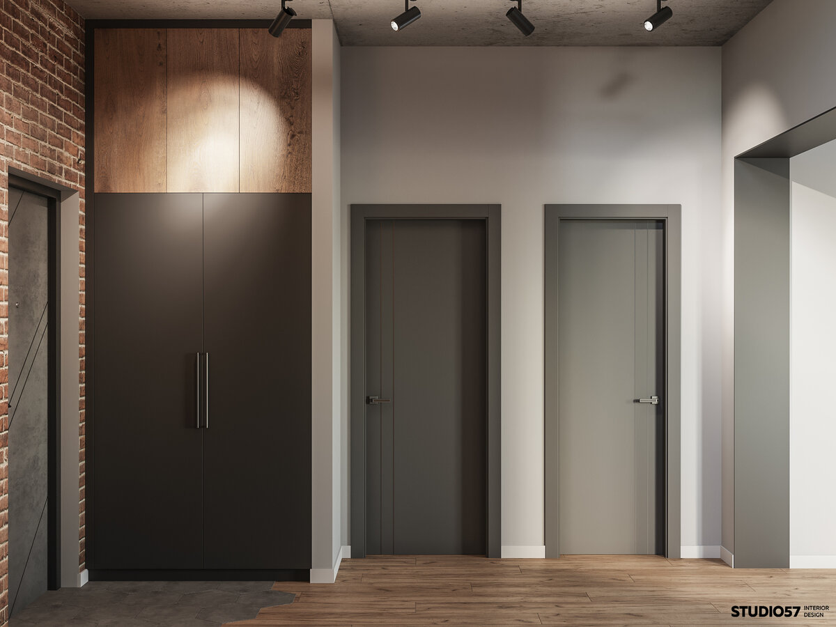  Также в прихожей мы разместили встроенный шкаф лаконичного чёрного цвета, верхние фасады под дерево.