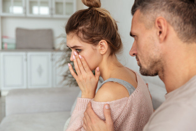 https://image.freepik.com/free-photo/back-view-of-careful-man-sitting-on-couch-and-calm-down-his-upset-girlfriend-which-crying-at-home_171337-333.jpg