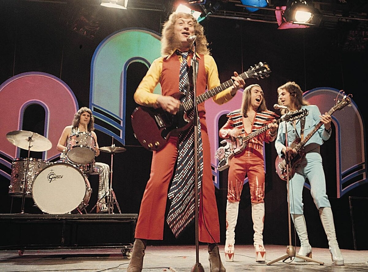 Slade Band. Группа Slade в 70х. Нодди холдер группа Slade. Группа Slade discography.