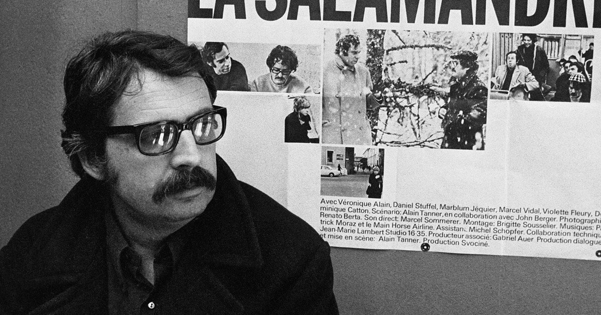Ален Таннер на фоне постера к одному из своих наиболее популярных фильмов "Саламандра" (1971)