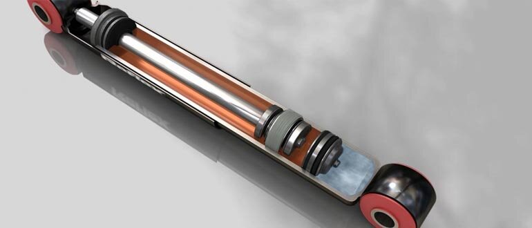 Масляные амортизаторы однотрубного типа, отличающиеся простотой конструкции. В качестве рабочей жидкости используется только специальное масло с определенным коэффициентом вязкости. Основная особенность такого решения — амортизатор работает только в одну сторону — на сжатие. Возвращение штока в исходное положение осуществляется за счет пружины.