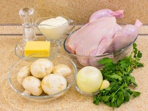 Ингредиенты: курица ( весом около 1,5-2кг ) , шампиньоны - 300гр , сыр ( твёрдый) - 100гр ,  лук - 1шт , чеснок - 1 зубчик , зелень , майонез, соль . 