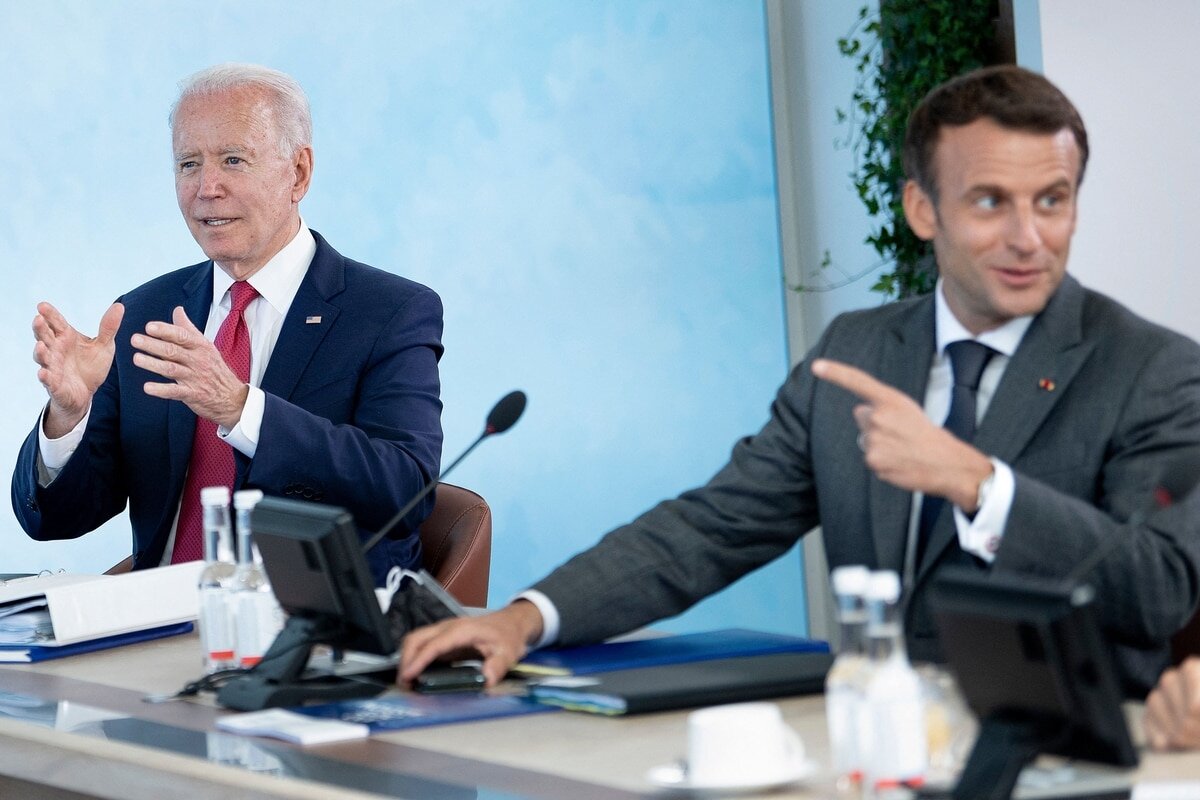  U.S. President Joe Biden, left, listens as French President Emmanuel Macron speaks at a working session during the G-7 summit in Carbis Bay, Cornwall, on June 12, 2021. (Brendan Smialowski/AFP via Getty Images)
