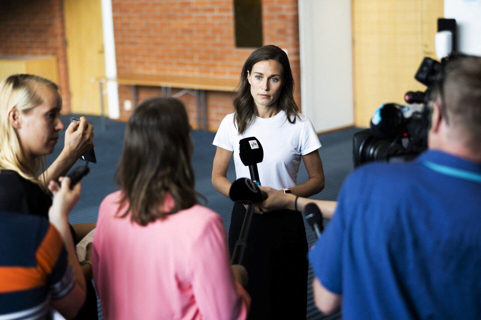 Finland's leader Sanna Marin apologizes for party photo at summer home - Washing