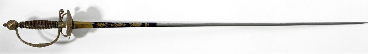 Камзольная шпага (Франция, 1710 - 1730). Длина 935 мм, длина клинка 761 мм, ширина клинка 20 мм, вес 360 г.