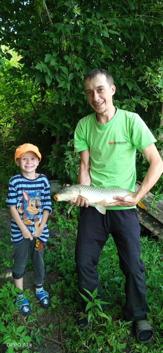 С сыном на частном пруду.