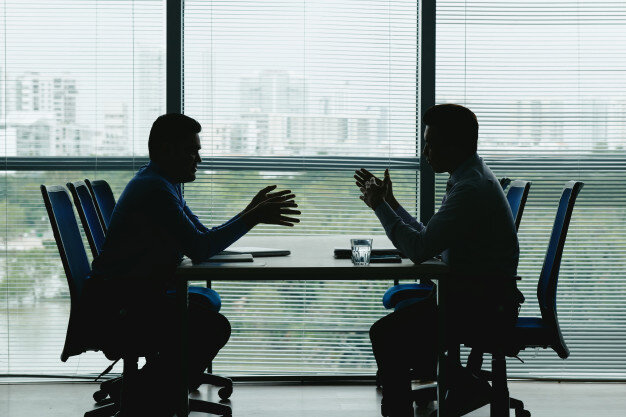 https://image.freepik.com/free-photo/two-human-outlines-against-the-shuttered-office-window-sitting-opposite-each-other-and-negotiating_1098-19254.jpg