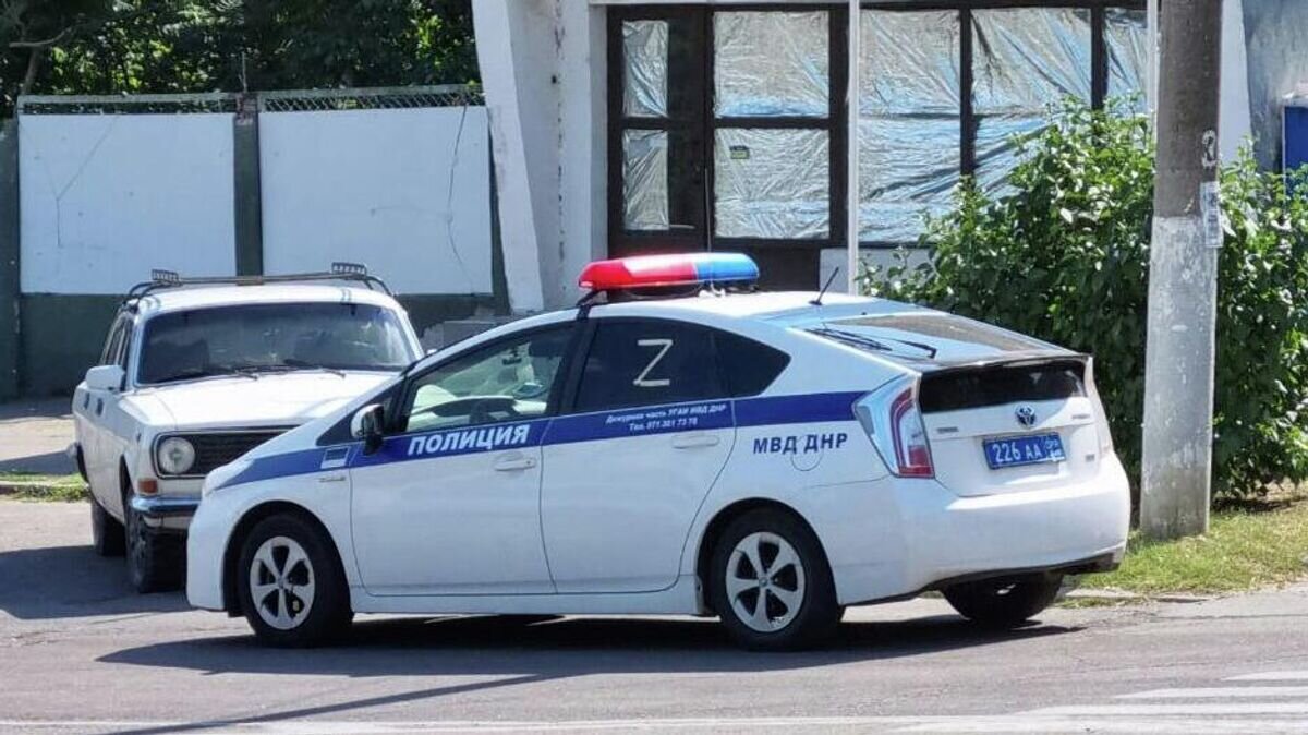    Автомобиль полиции в Херсоне© РИА Новости