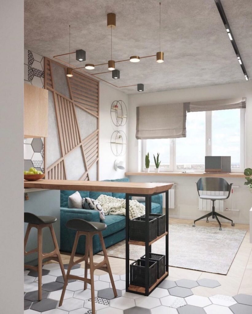 Вместо традиционного белого оттенка был выбран модный серо-зеленый оттенок, который смягчен кремовым оттенком. Штукатурка с имитацией бетона выполняет роль акцента и превносит в интерьер эстетику лофта.