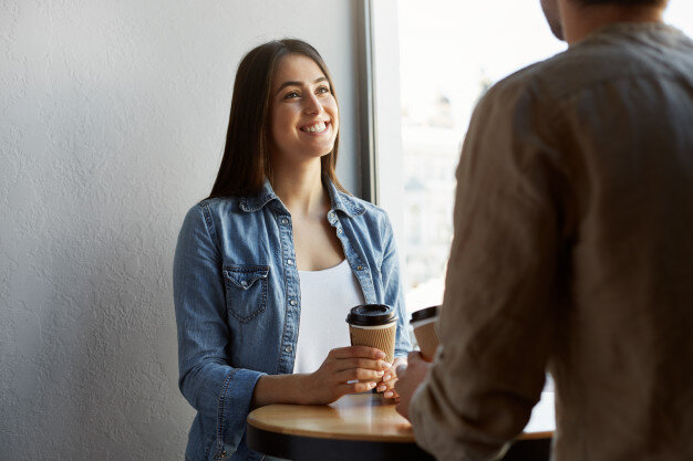 https://image.freepik.com/free-photo/beautiful-happy-girl-with-dark-hair-in-white-t-shirt-under-denim-shirt-drinks-coffee-and-smiling-listening-to-friend-s-story-from-yesterday-party_176420-9180.jpg