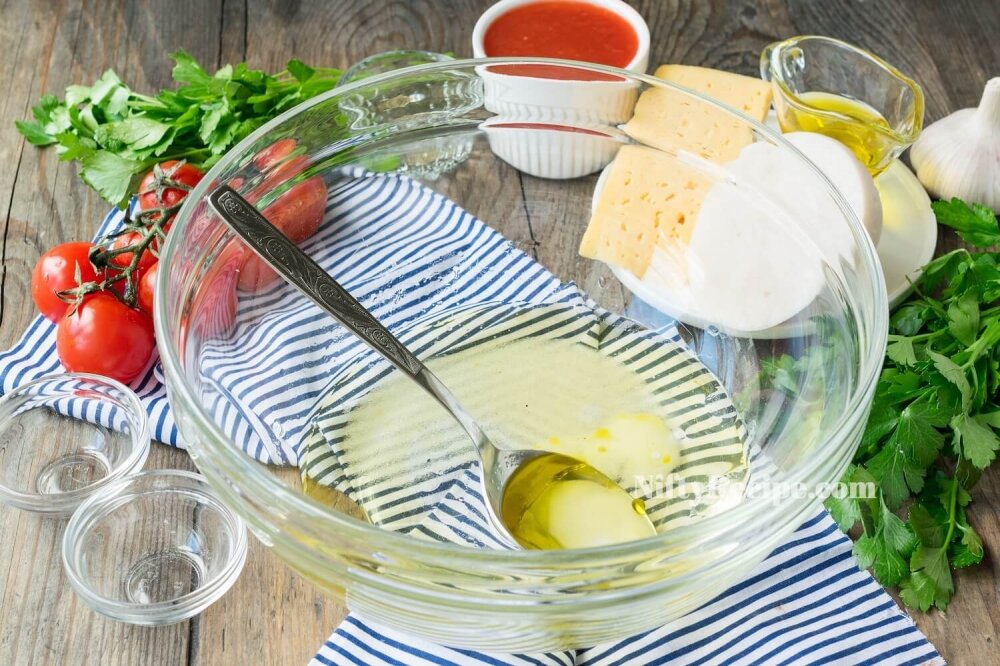2. In deep bowl, combine warm water and olive oil. Add salt and sugar.