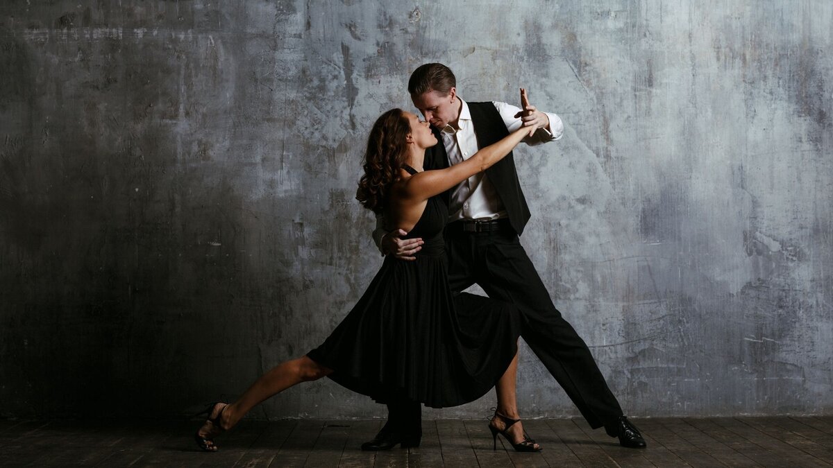 Who is she dancing with?