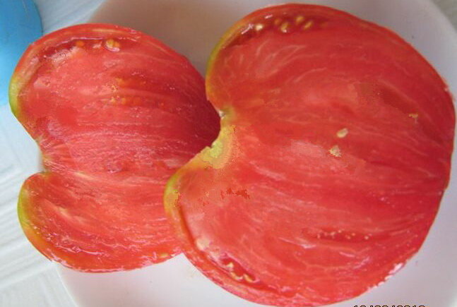 Сорт томата бычье сердце розовое. Томат Бычье сердце. Томат Бычье сердце розовое. Сорт томатов Бычье сердце гигант. Бычье сердце томат в разрезе.