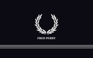 В 1952 году Фредерик Перри и Тиби Вагнер основали бренд Fred Perry по созданию одежды для профессионального спорта. Перри являлся заядлым курильщиком и в качестве торгового знака марки хотел выбрать изображение курительной трубки. Вагнер отговорил партнера, предложив сделать эмблемой бренда лавровый венок – символ героических побед Фредерика на корте: «А как же лавровый венок? Да, именно тот, который красуется на твоей спортивной куртке и свитере участника Кубка Дэвиса!»