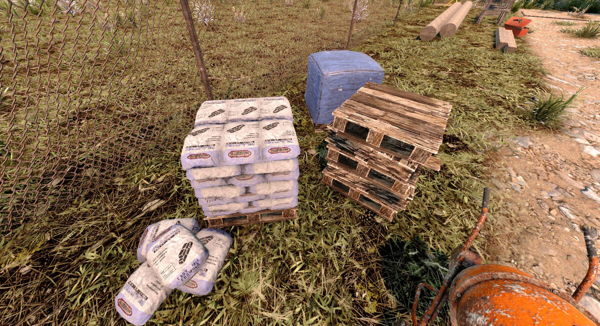 Мешки с цементом и блок булыжника