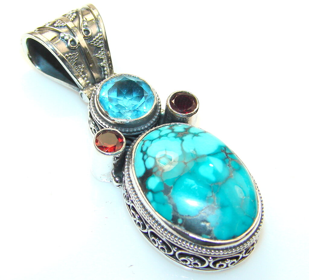 Кулон серебряный с бирюзой, топазом и гранатами в этническом стале