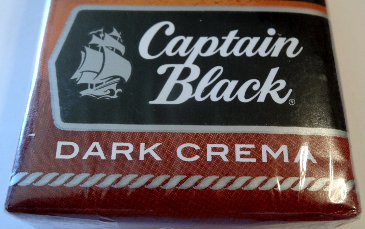 Сигареты шоколад цена. Сигареты Captain Black шоколадные. Сигареты шоколад Капитан Капитан Блэк. Капитан Блэк сигареты с шоколадом. Captain Black Dark crema.