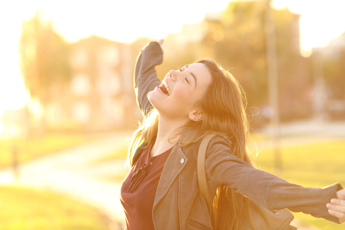 Happy girls hand up. Breathing enjoy.