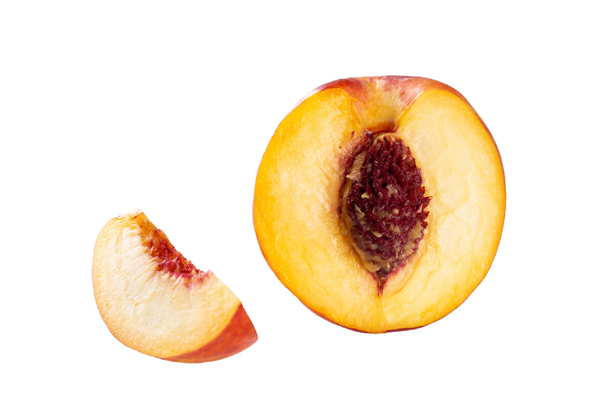 Женский половой персик. Половина персика. Долька персика.
