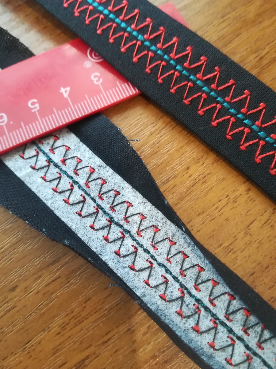 Эта тесьма - образец, для рубашки сына я использовала другие строчки и нитки.