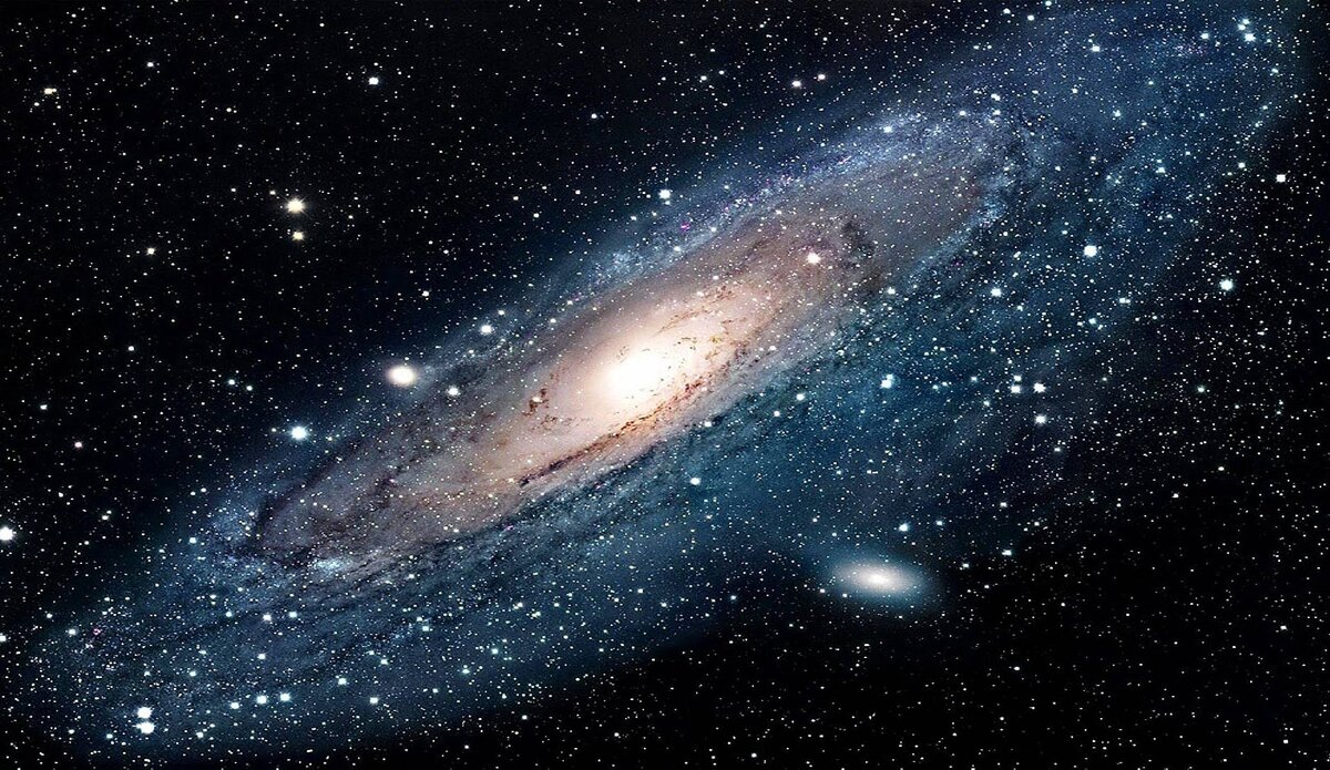 ГЛУБОКИЙ ВЗГЛЯД. Галактика NGC 4319 и квазар Маркарян 205 (вверху справа) - странная пара. NGC 4319 находится на расстоянии 80 миллионов световых лет от Земли, но квазар находится на расстоянии миллиарда световых лет от Земли. 