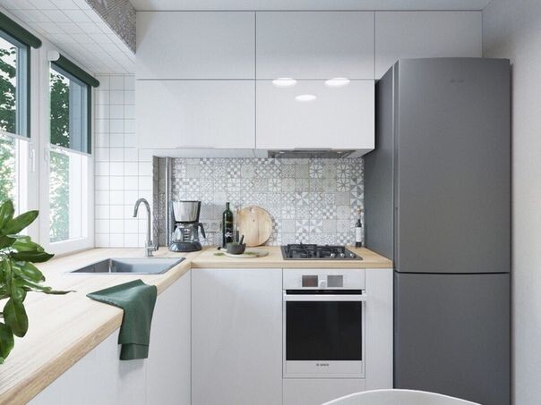 Глянцевый, белый фасад зрительно увеличит вашу кухню