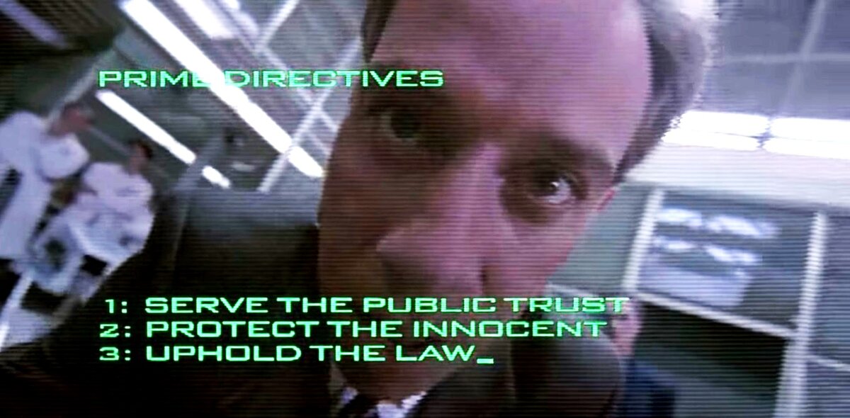 Кадр из фильма РОБОКОП 1998 год. по сюжету он не проговаривает 4 директиву, но она такая же  как и ситуации в  статье. Пароль "Свои"