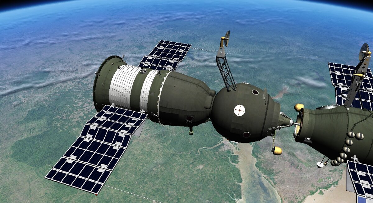 Гениальный русский корабль Союз. Передняя шарообразная часть- бытовой отсек. Средняя, круглой конусной формы - спускаемый аппарат, Задняя, с развернутыми солнечными панелями - разгонный блок (приборно-агрегатный отсек).
