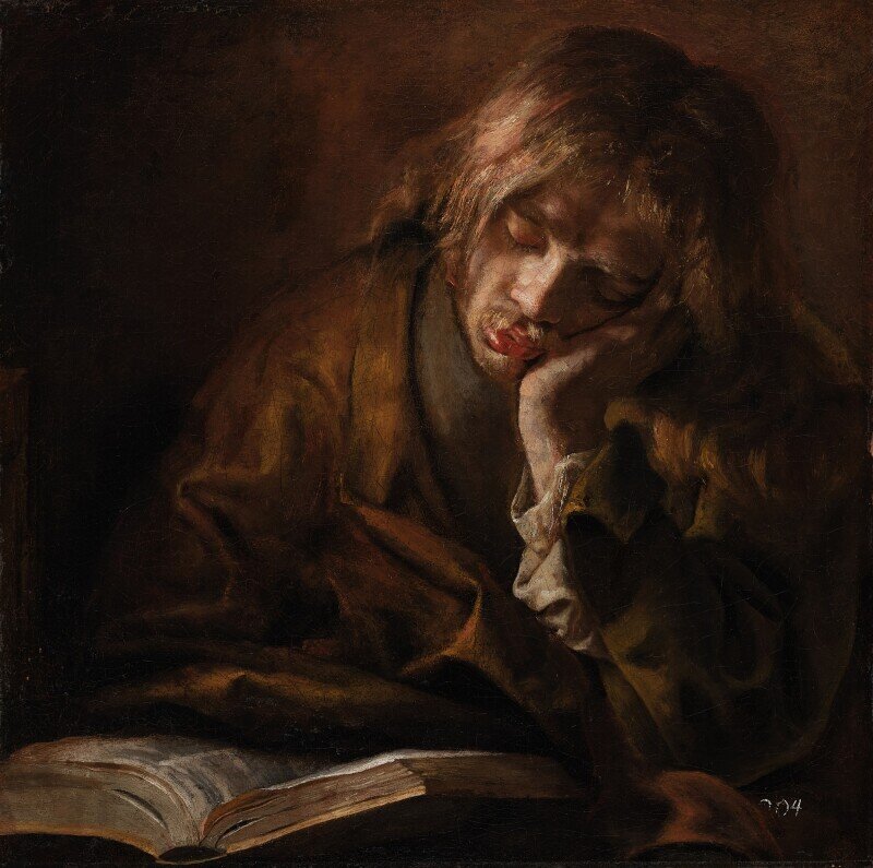 Artist active in the circle of Rembrandt van Rijn, circa 1640-1650. Young man asleep before an open book