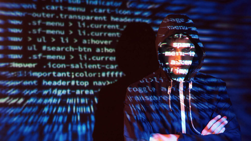    Cyber attack with unrecognizable hooded hacker using virtual reality, digital glitch effect. Александр Шереметьев